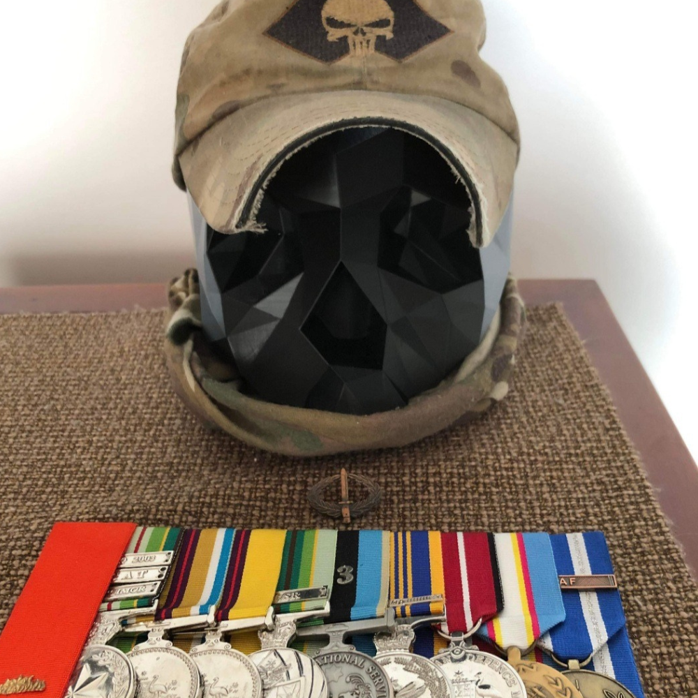 Brown punisher hat and military medal display